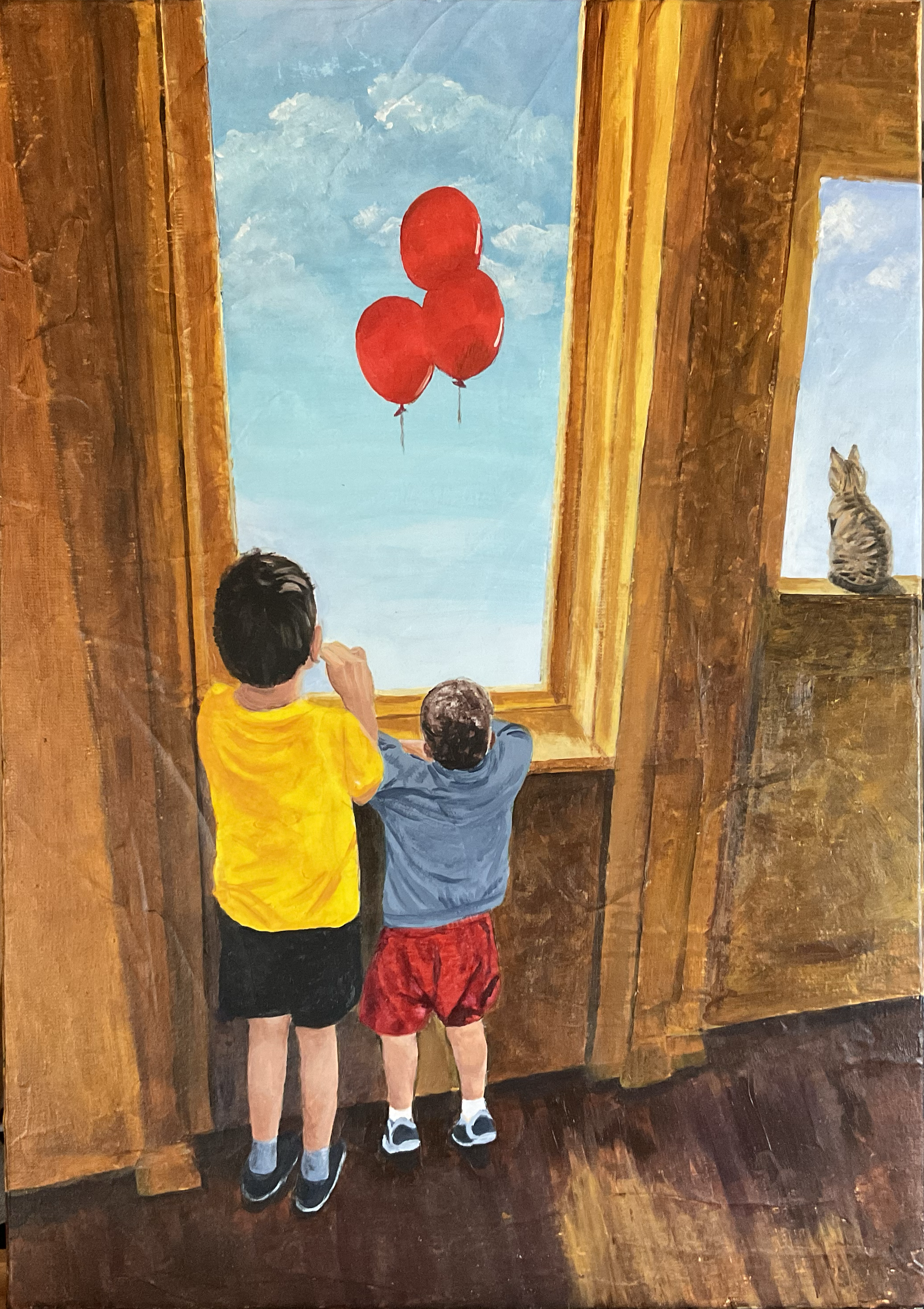 Two children and a cat look out the window